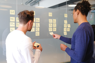 employees in front board tasks