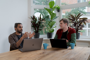two employees chatting office