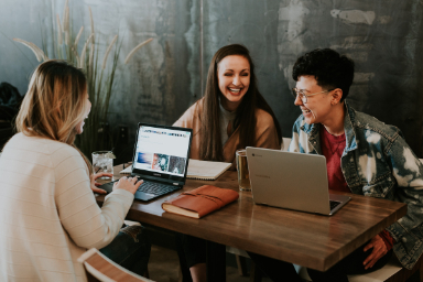 women laughing office
