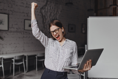 woman happy with laptop