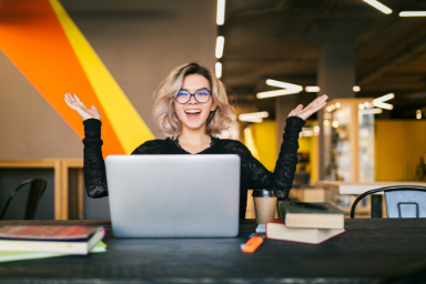 Funny Happy Excited Young Pretty Woman Sitting Table Black Shirt Working Laptop Co Working Office Wearing Glasses 1