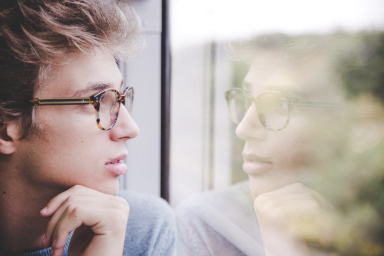 man staring windows